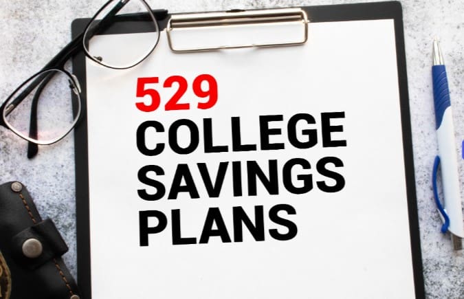 A clipboard with the words 5 2 9 college savings plans written on it.